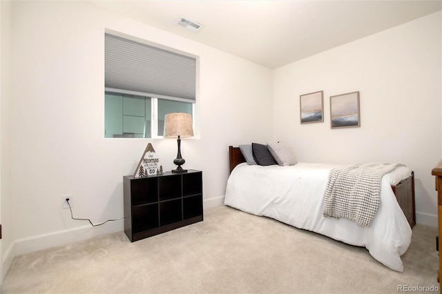 bedroom with light carpet