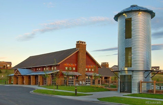 view of outdoor building at dusk