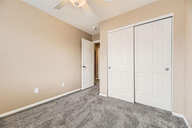 unfurnished bedroom with a closet, ceiling fan, and dark colored carpet