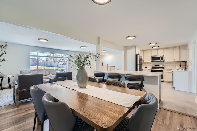 6923 S Albion St, Centennial, CO 80122 - dining area featuring light wood-style flooring