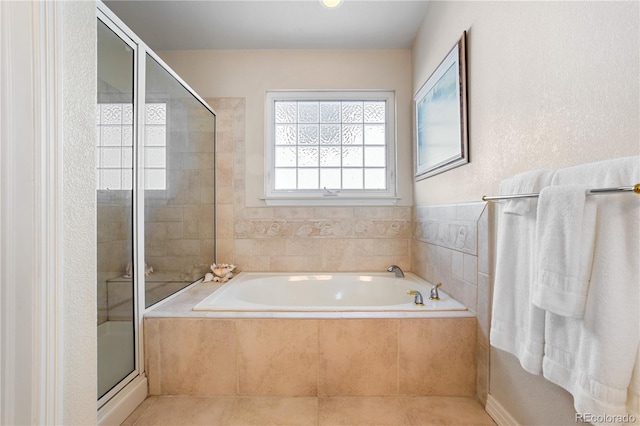 bathroom featuring plus walk in shower and tile patterned floors