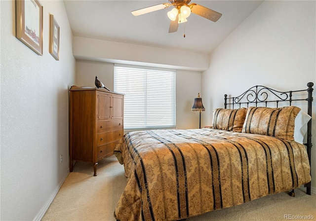 carpeted bedroom featuring ceiling fan and lofted ceiling