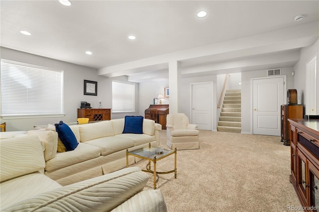 living room featuring light carpet