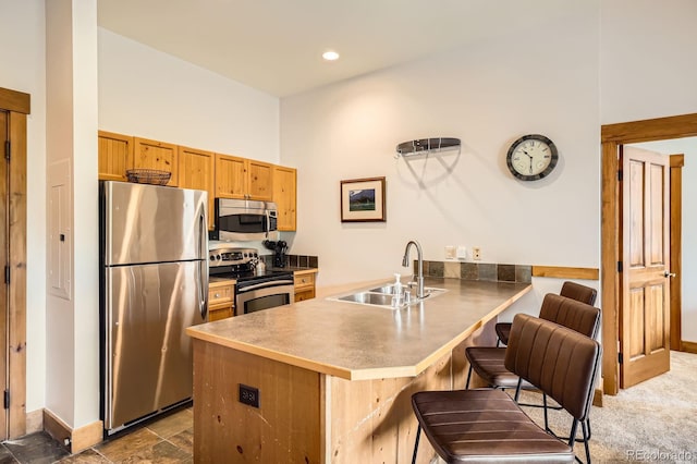 53 Hunki Dori Ct Unit 8905, Dillon, CO 80435 - kitchen featuring appliances with stainless steel finishes, a peninsula, a kitchen breakfast bar, and recessed lighting