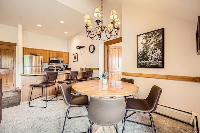 53 Hunki Dori Ct Unit 8905, Dillon, CO 80435 - dining area with a baseboard radiator, a chandelier, recessed lighting, and light carpet