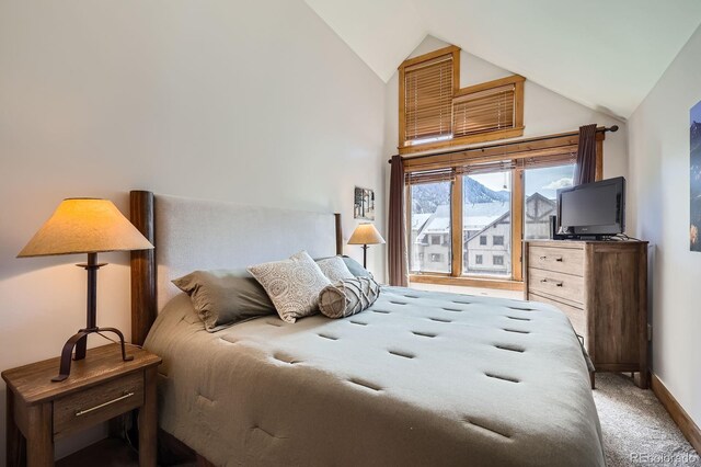53 Hunki Dori Ct Unit 8905, Dillon, CO 80435 - carpeted bedroom featuring vaulted ceiling and baseboards