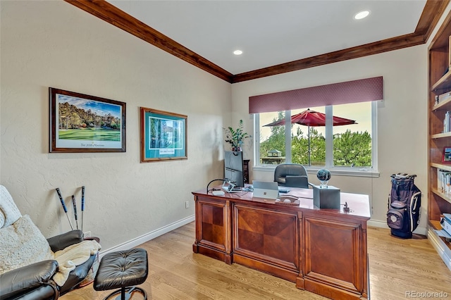 office area with crown molding and light hardwood / wood-style flooring