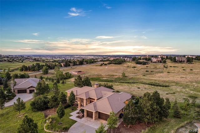 aerial view at dusk featuring a rural view