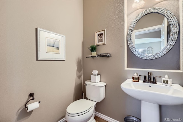 bathroom with sink and toilet