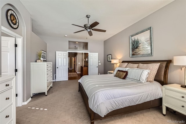 bedroom with light colored carpet and ceiling fan