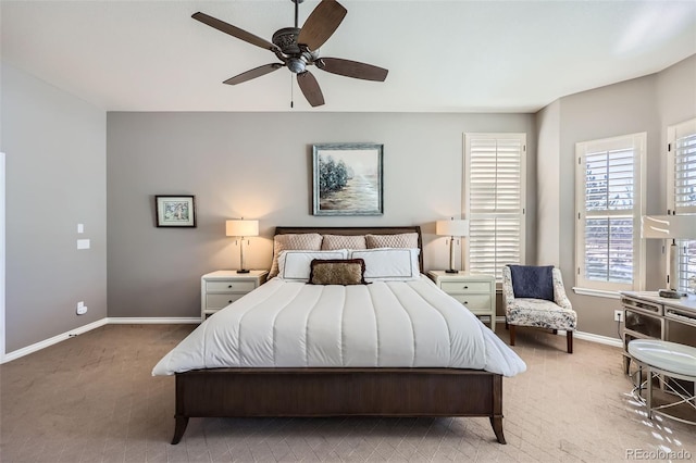 bedroom featuring ceiling fan and carpet