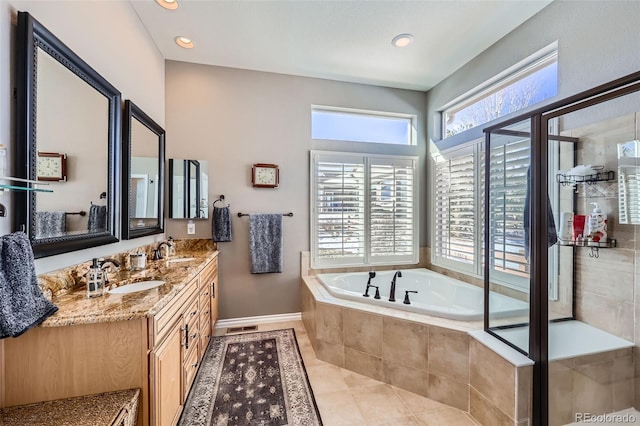 bathroom featuring vanity, tile patterned floors, and independent shower and bath