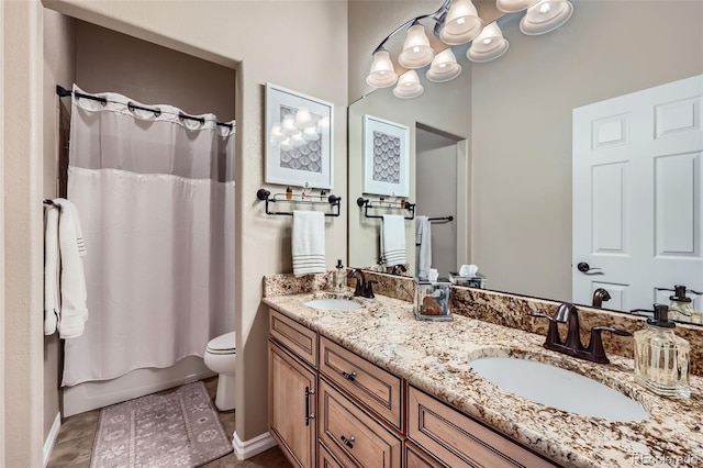 full bathroom featuring vanity, shower / tub combo with curtain, tile patterned floors, and toilet