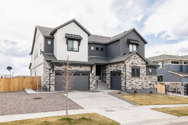 17252 Rose Mallow Ave, Parker, CO 80134 - view of front of house with driveway, stone siding, board and batten siding, an attached garage, and fence