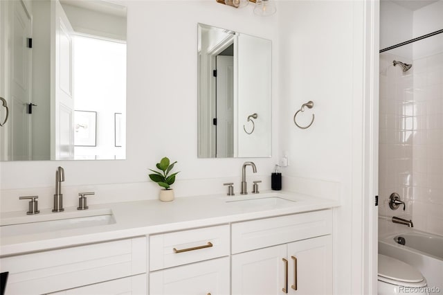 17252 Rose Mallow Ave, Parker, CO 80134 - bathroom featuring shower / bath combination, double vanity, a sink, and toilet