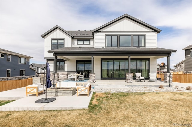 17252 Rose Mallow Ave, Parker, CO 80134 - rear view of property featuring a patio, board and batten siding, fence, and a lawn