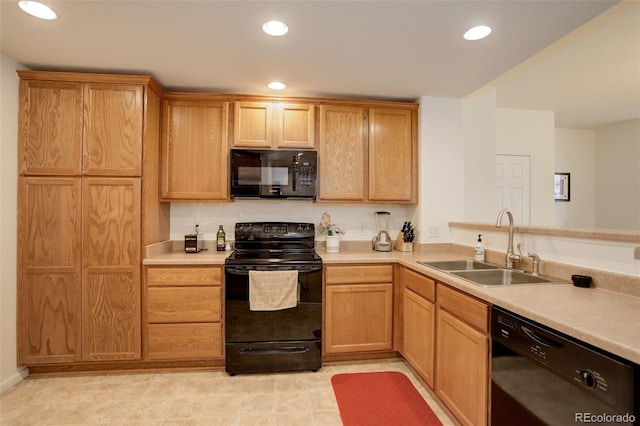 kitchen featuring sink and black appliances