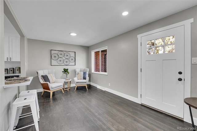 sitting room with visible vents, baseboards, dark wood-style flooring, and recessed lighting