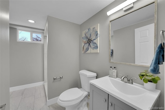 full bathroom with marble finish floor, recessed lighting, toilet, vanity, and baseboards