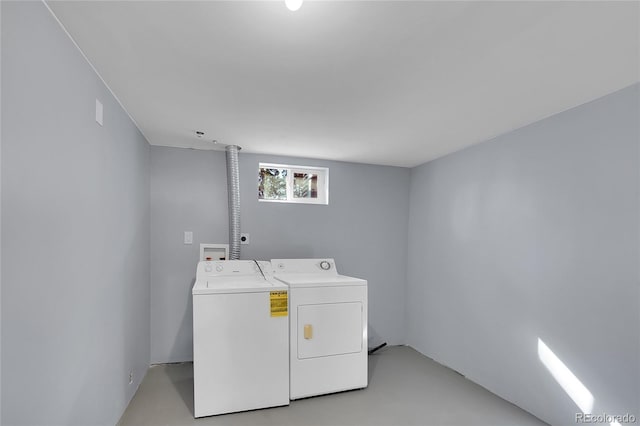 clothes washing area with laundry area and washer and dryer