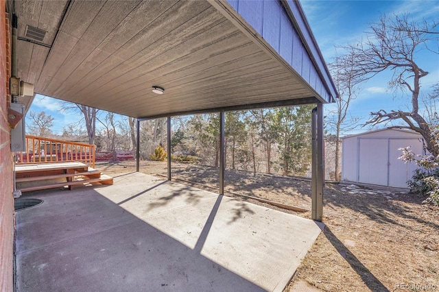 view of patio / terrace featuring a storage unit and an outdoor structure