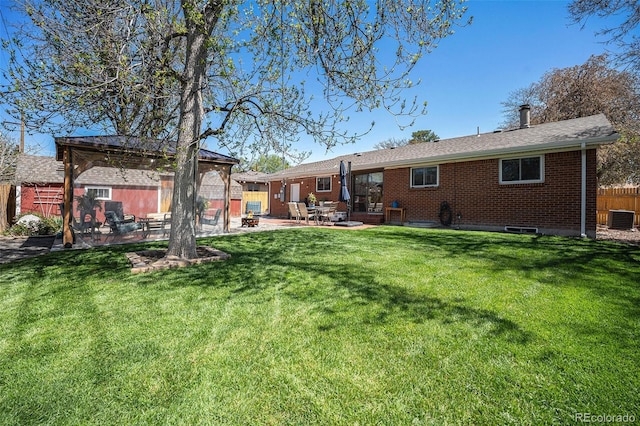 7071 Beach St, Westminster, CO 80030 - rear view of house with a patio area, brick siding, and a gazebo