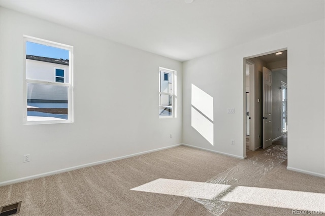 spare room featuring carpet flooring