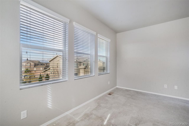 6093 Rowdy Dr, Colorado Springs, CO 80924 - carpeted empty room featuring visible vents and baseboards