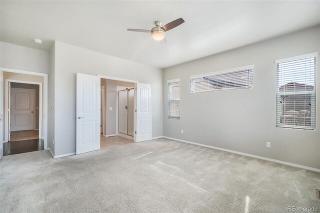 6093 Rowdy Dr, Colorado Springs, CO 80924 - unfurnished bedroom featuring ceiling fan, baseboards, and light carpet