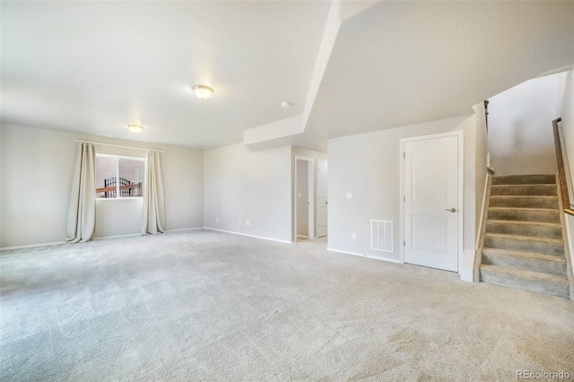 6093 Rowdy Dr, Colorado Springs, CO 80924 - unfurnished living room featuring baseboards, visible vents, stairs, and light carpet