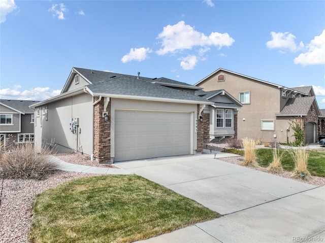 6093 Rowdy Dr, Colorado Springs, CO 80924 - ranch-style home with roof with shingles, driveway, stone siding, a garage, and stucco siding