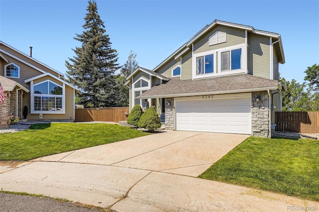 9385 Pepperwood Ln, Highlands Ranch, CO 80126 - view of front of home with a garage, driveway, stone siding, and a shingled roof