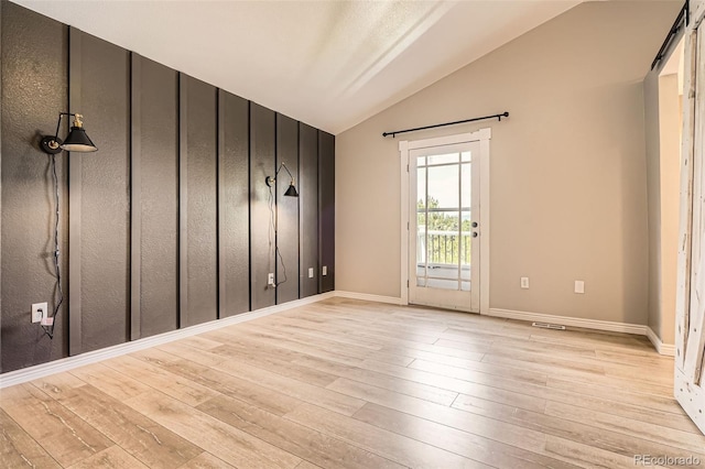 9385 Pepperwood Ln, Highlands Ranch, CO 80126 - empty room with lofted ceiling and light wood finished floors