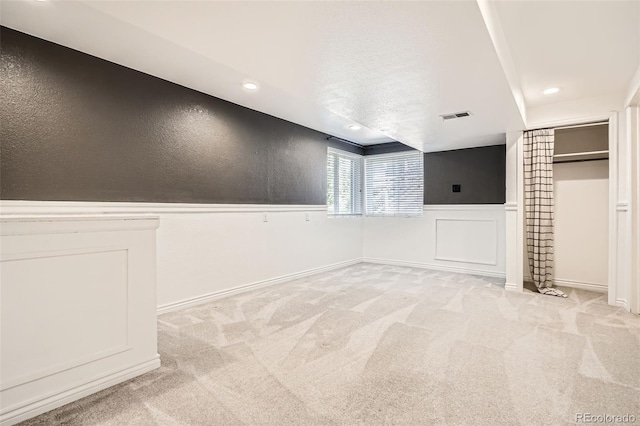 9385 Pepperwood Ln, Highlands Ranch, CO 80126 - unfurnished room featuring light carpet, a wainscoted wall, and recessed lighting