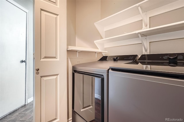 9385 Pepperwood Ln, Highlands Ranch, CO 80126 - laundry area with washer and clothes dryer and wood finished floors