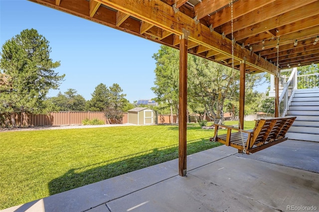 9385 Pepperwood Ln, Highlands Ranch, CO 80126 - fenced backyard featuring a shed, a patio area, and stairway