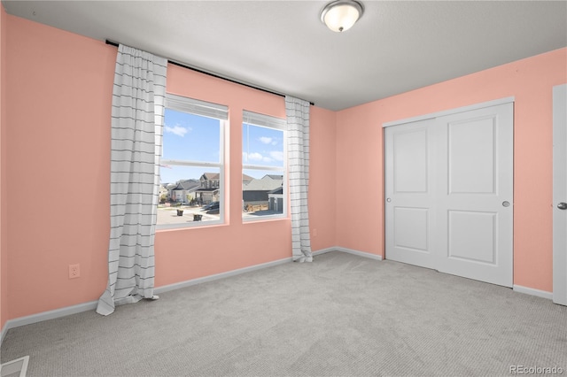 9257 Mayflower Gulch Way, Colorado Springs, CO 80927 - unfurnished bedroom featuring carpet floors, baseboards, and a closet