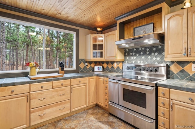 kitchen featuring under cabinet range hood, light brown cabinets, range with two ovens, and wood ceiling