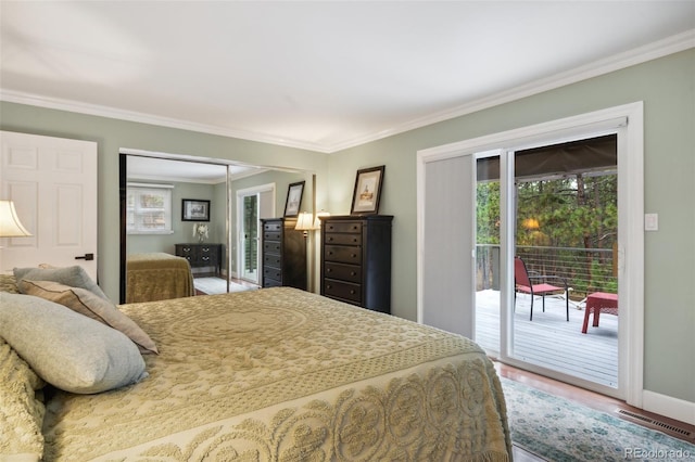 bedroom with a closet, baseboards, visible vents, access to outside, and crown molding