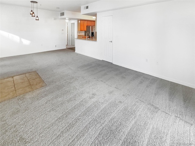 unfurnished living room with carpet floors