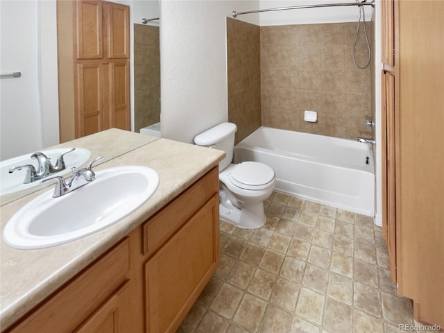 full bathroom featuring vanity, toilet, and tiled shower / bath