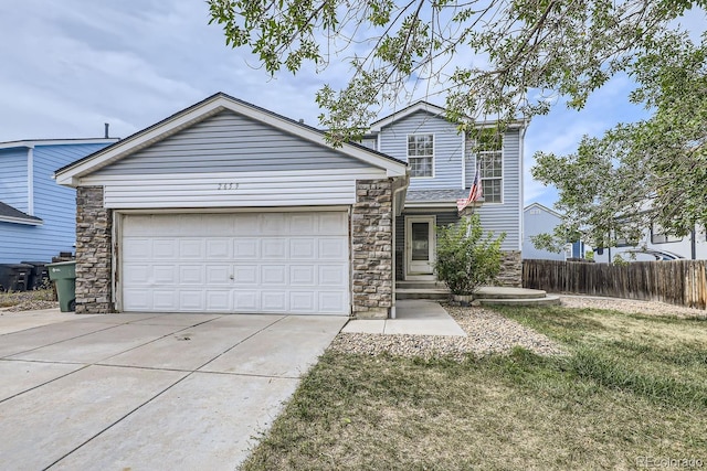 view of front facade with a garage and a front yard