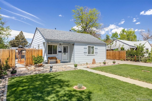 935 Newark St, Aurora, CO 80010 - view of front facade with a shingled roof and a gate