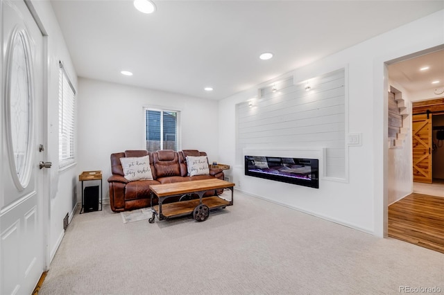 935 Newark St, Aurora, CO 80010 - living room with a glass covered fireplace, recessed lighting, carpet flooring, and baseboards