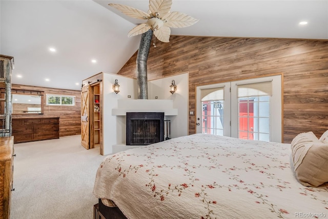 935 Newark St, Aurora, CO 80010 - bedroom featuring wood walls, carpet floors, access to outside, high vaulted ceiling, and recessed lighting