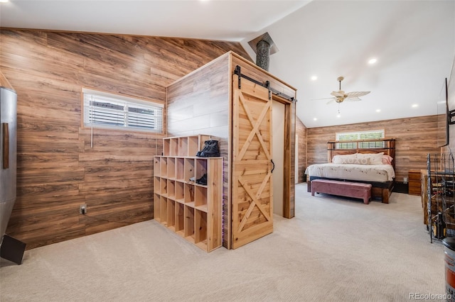 935 Newark St, Aurora, CO 80010 - carpeted bedroom with lofted ceiling, wooden walls, a barn door, and recessed lighting