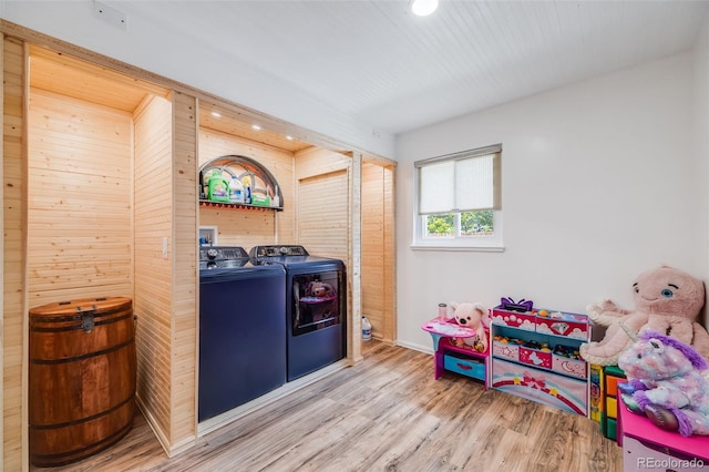 935 Newark St, Aurora, CO 80010 - washroom with washer and clothes dryer, wood finished floors, recessed lighting, wooden walls, and baseboards