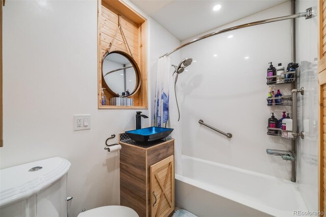 935 Newark St, Aurora, CO 80010 - bathroom featuring toilet, shower / bath combo, and vanity