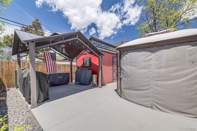 935 Newark St, Aurora, CO 80010 - view of patio featuring a gazebo and an outbuilding