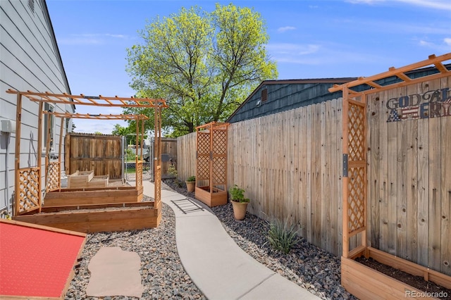 935 Newark St, Aurora, CO 80010 - fenced backyard featuring a vegetable garden